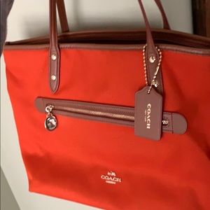 Like new burnt orange Coach purse.